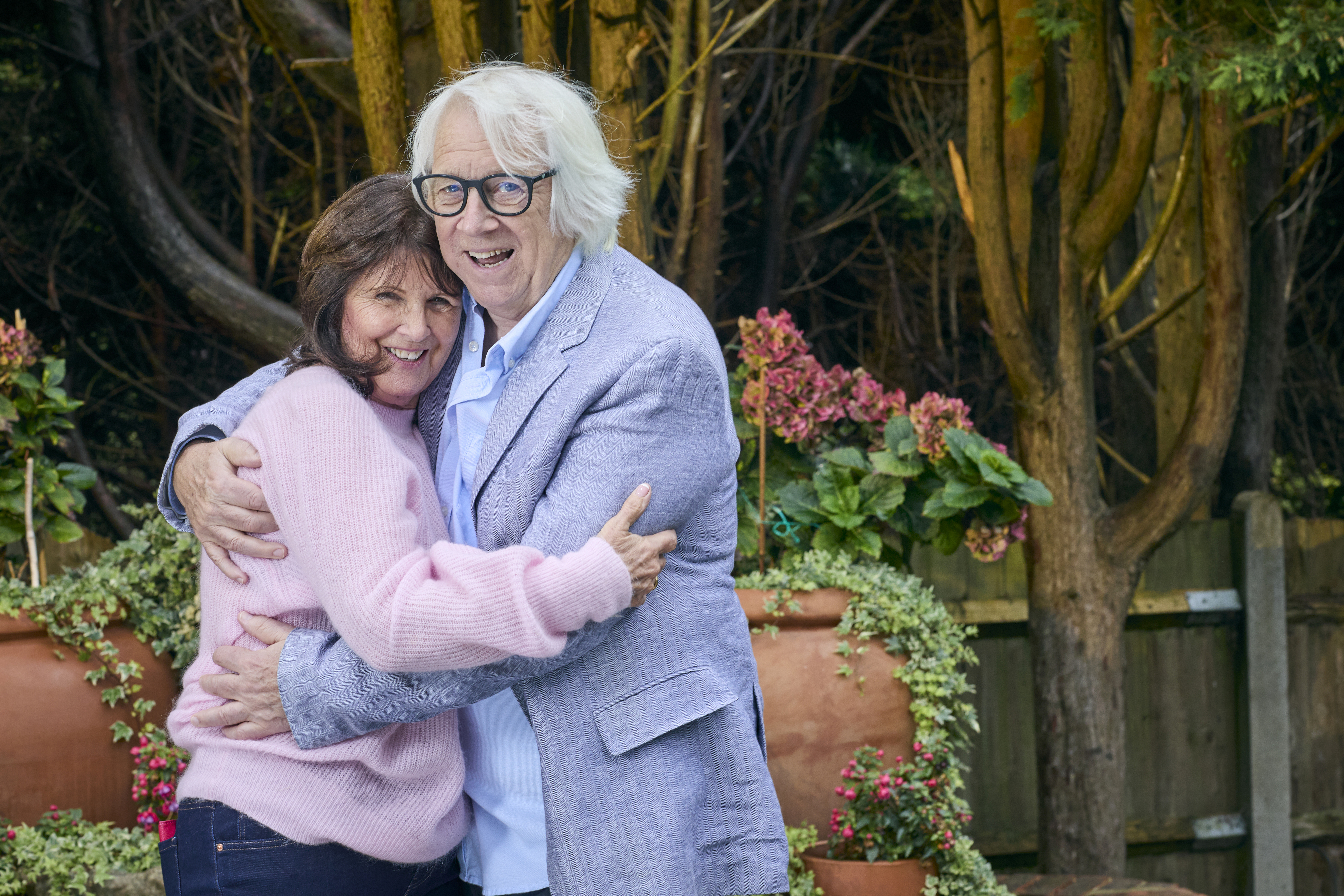 Tony and his wife Jan, smiling, with their arms around each other