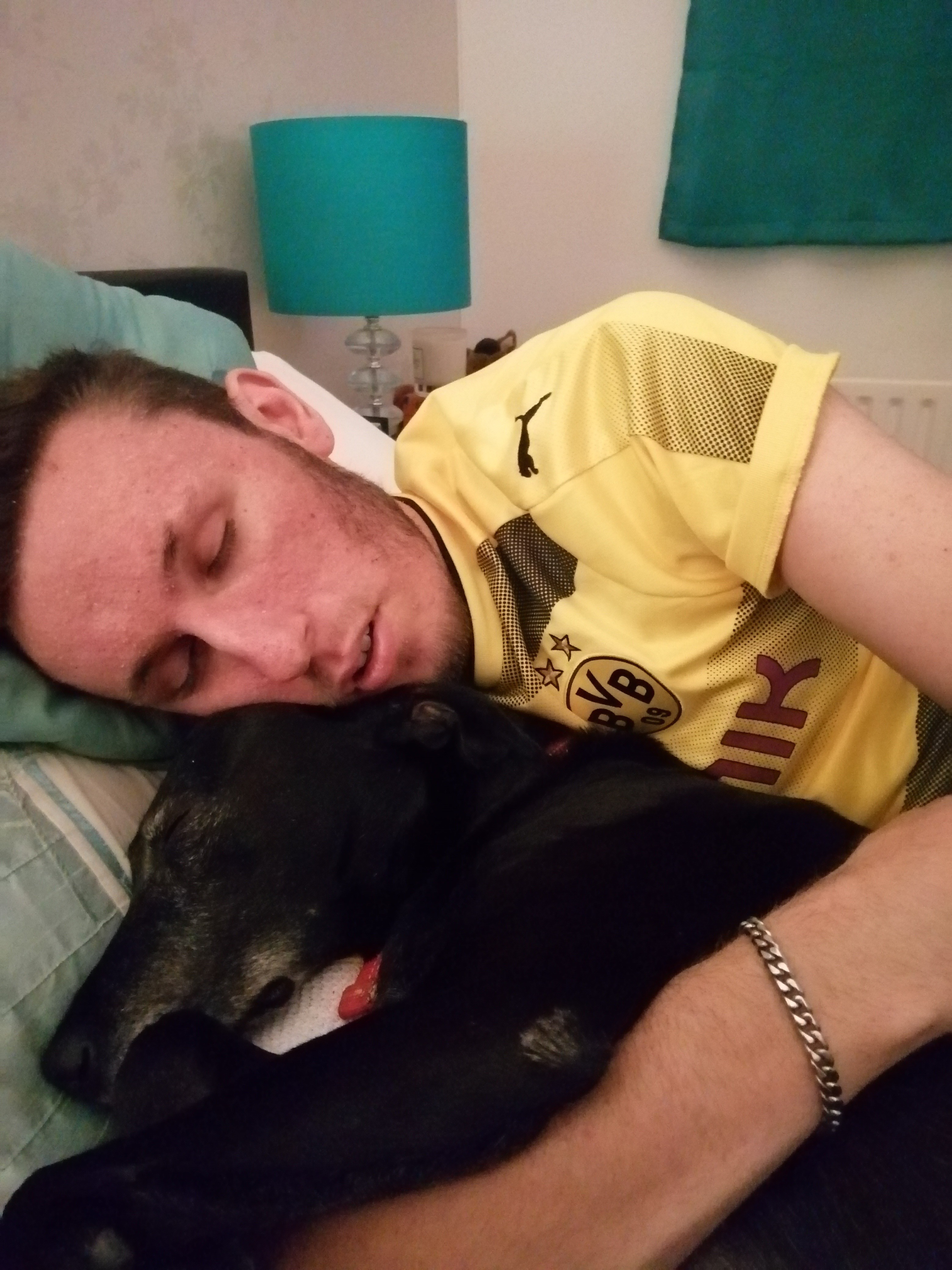 Bradley lies on his bed with Buster