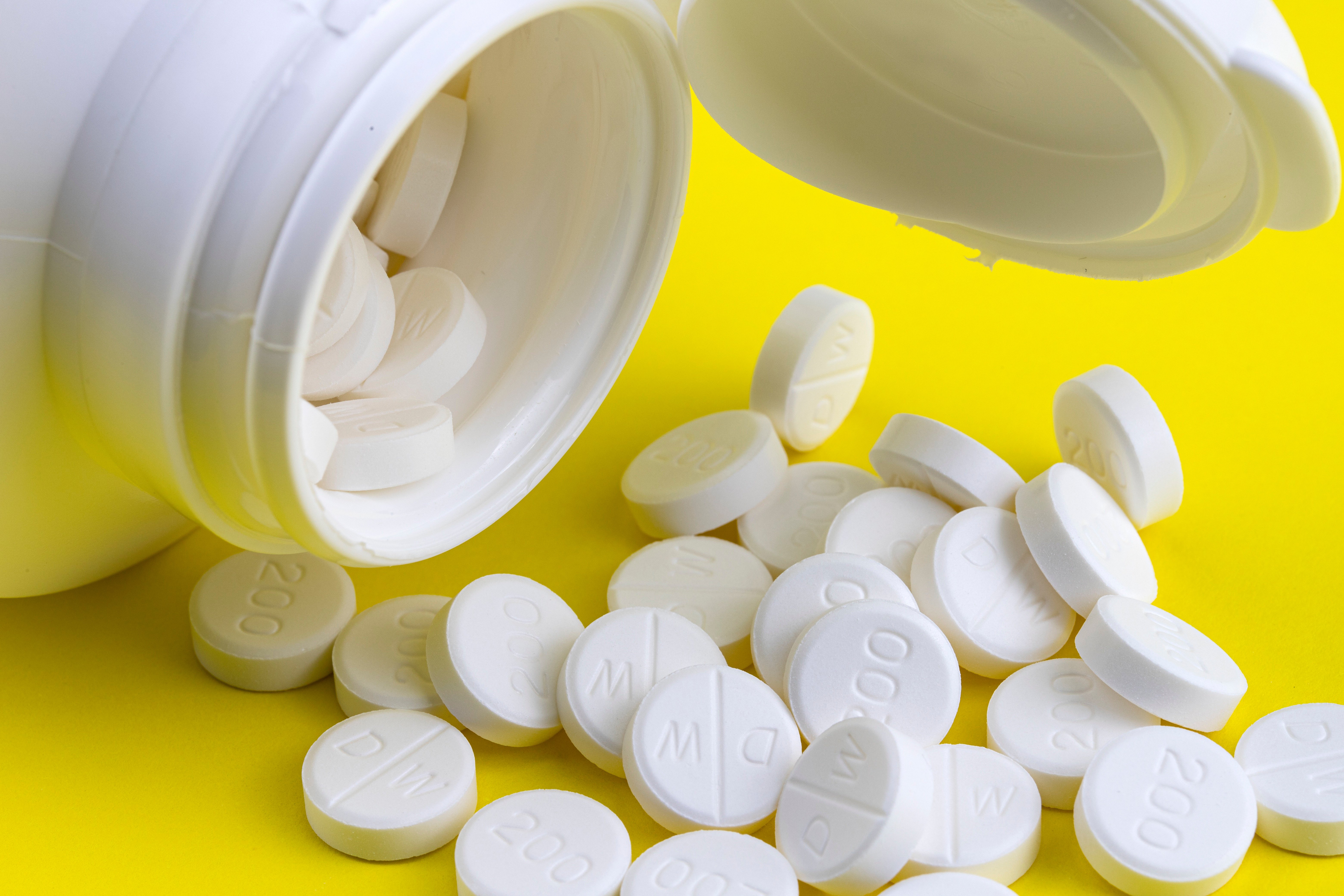 Image of pill bottle with pills spilling out