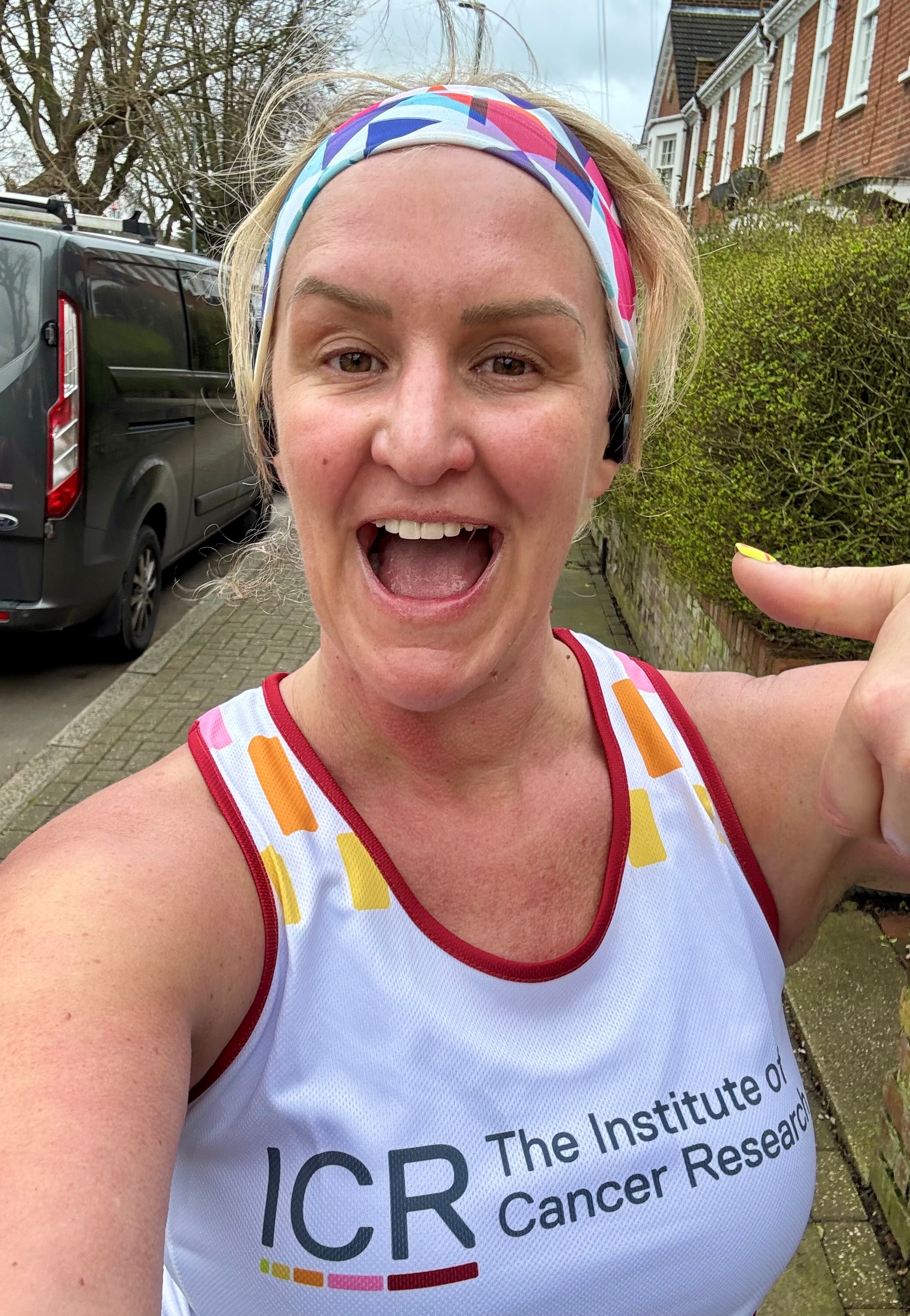 Jo wears a white ICR vest and a headband