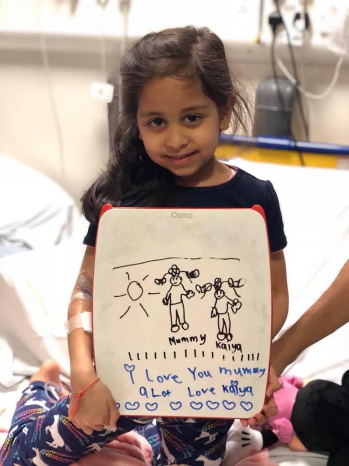 Kaiya holding a picture she has drawn (credit: Annu Patel)