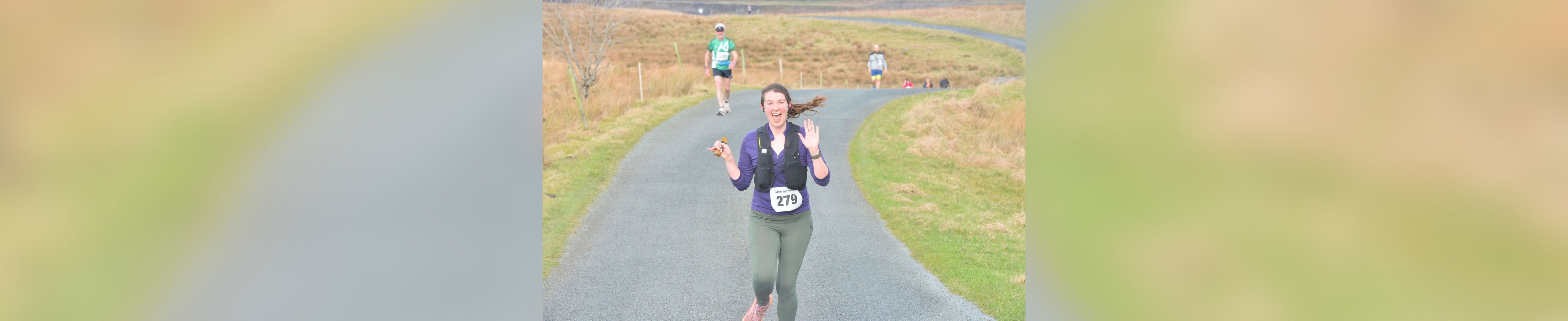 Emily Webster running in the countryside