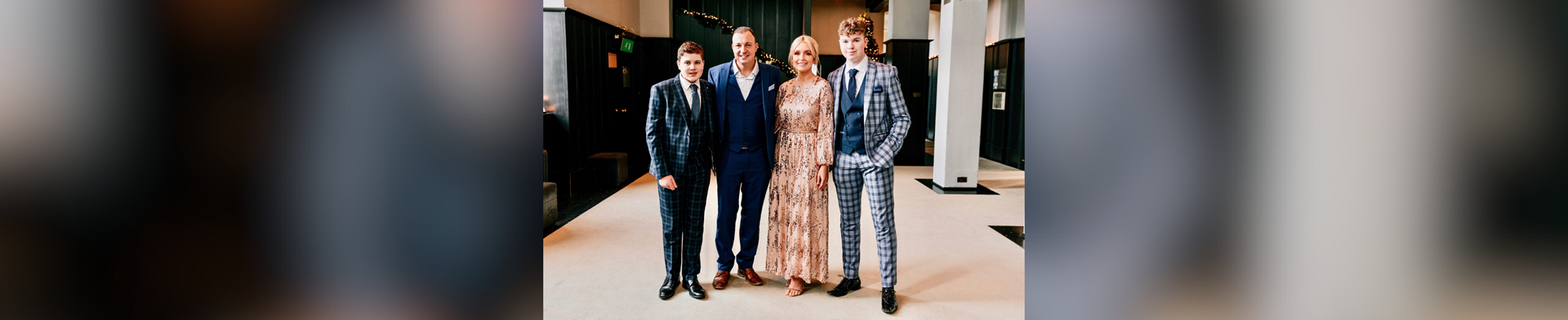 Daniel with brother Saul, dad Brian and mum Alison in smart dress