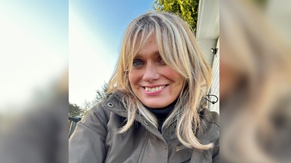 Elen Hughes smiling into camera