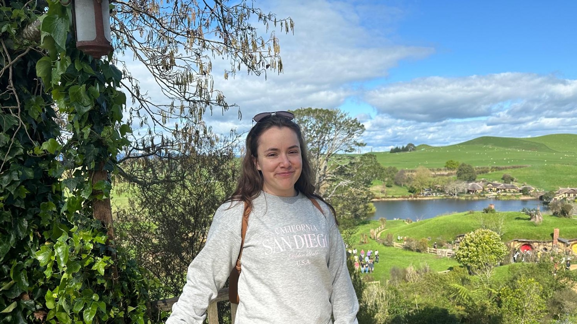 Nadia Hearn with rolling hills and a lake in the background