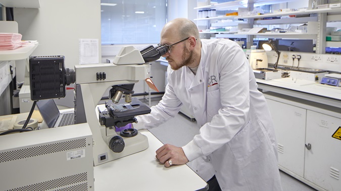 Scientist with microscope