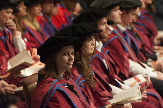 Students wearing robe and hats at their graduation ceremony