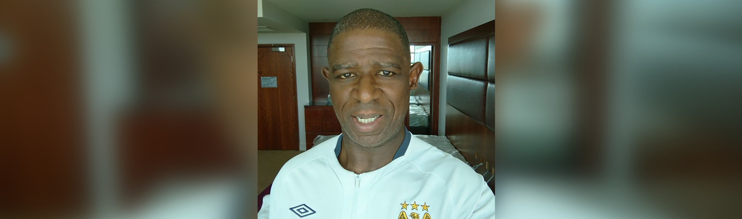 Image of Gilly wearing a Manchester City Football shirt