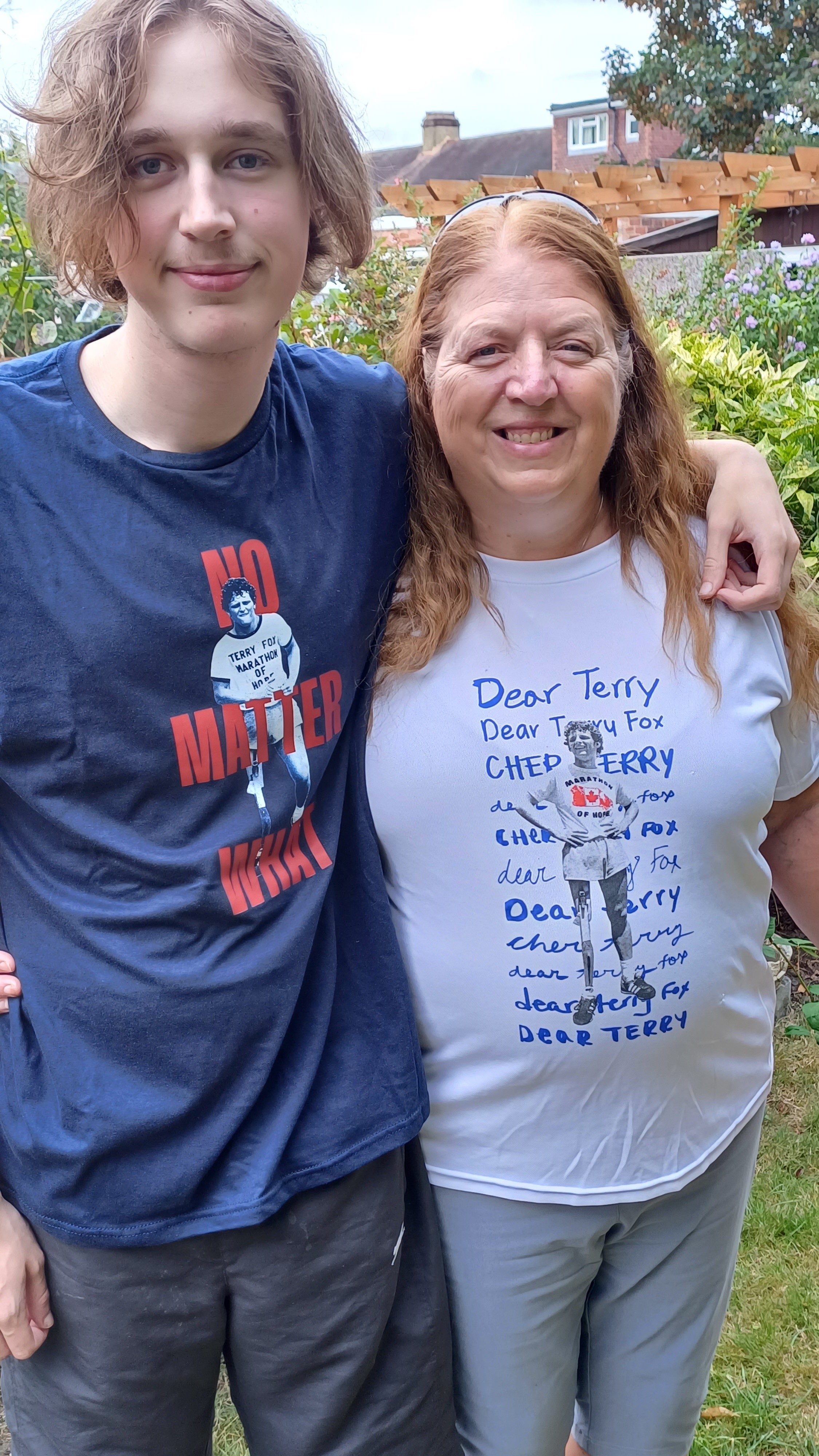 Shelley with her son Tom wearing official T-shirts Shelley and her son Tom pose for the camera wearing official Terry Fox T-shirts