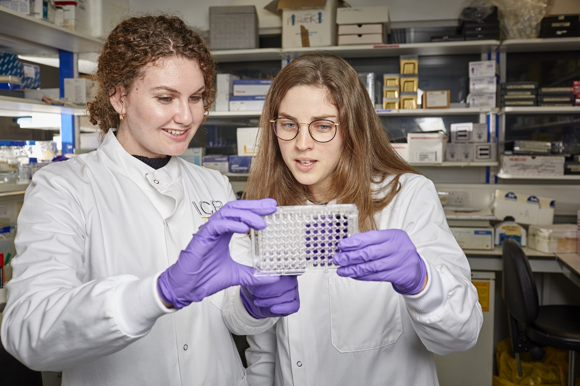 Two women in a lab looking at test results