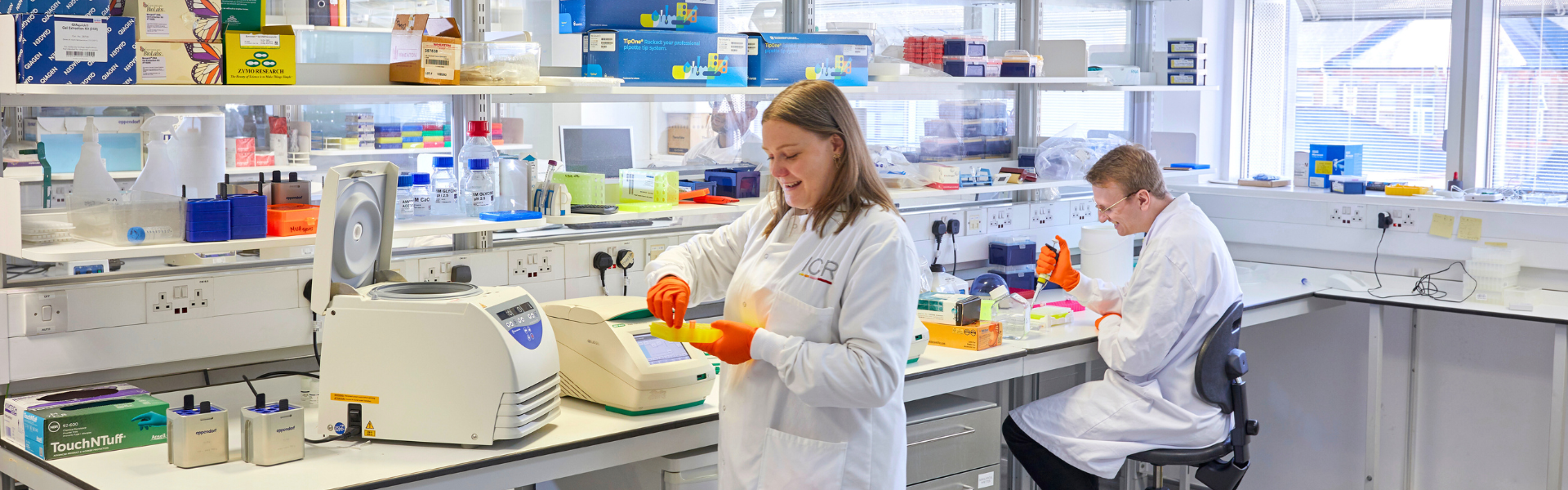 Two ICR scientists, one female, one male, working in the labs