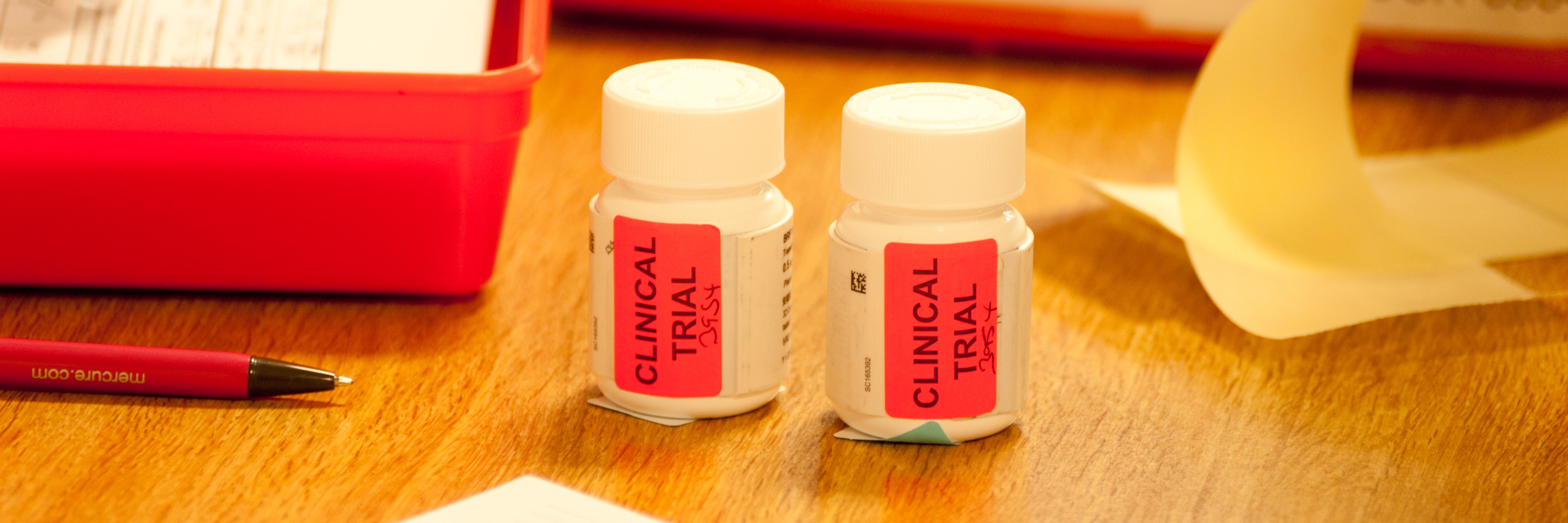 Clinical trial bottles Two pill bottles with a red 'clinical trial' label