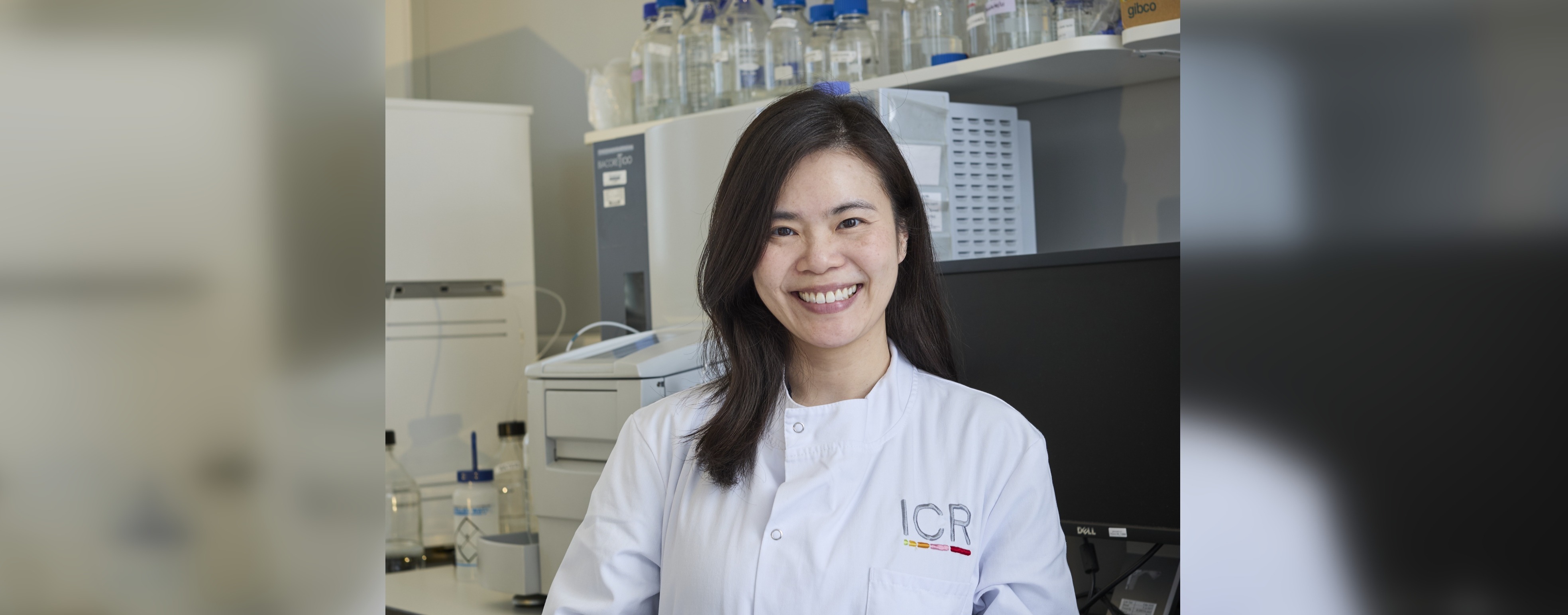 Dr Kathy Chung Ying Chan smiling into the camera, wearing a lab coat