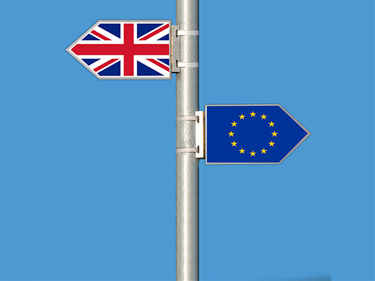 British and EU flags on signpost British and EU flags on signpost