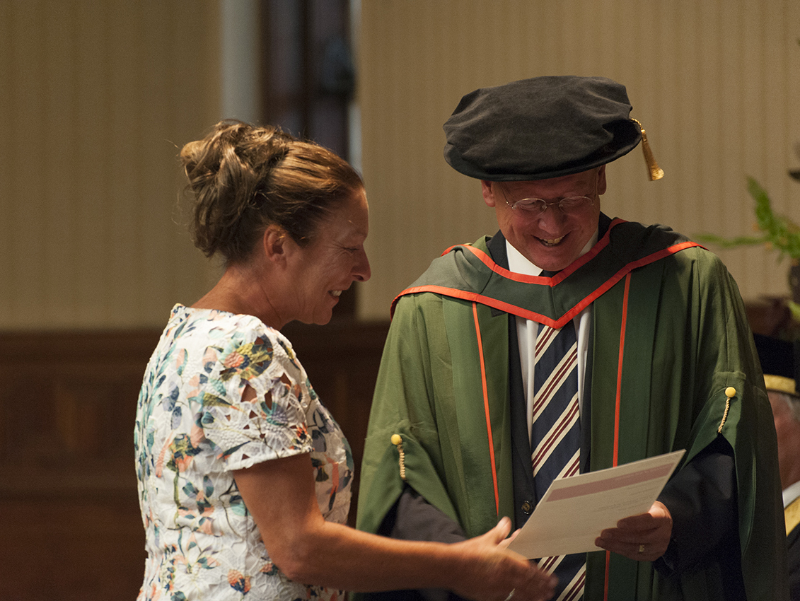 Professor Paul Workman presenting a graduation certificate Professor Paul Workman presenting a graduation certificate