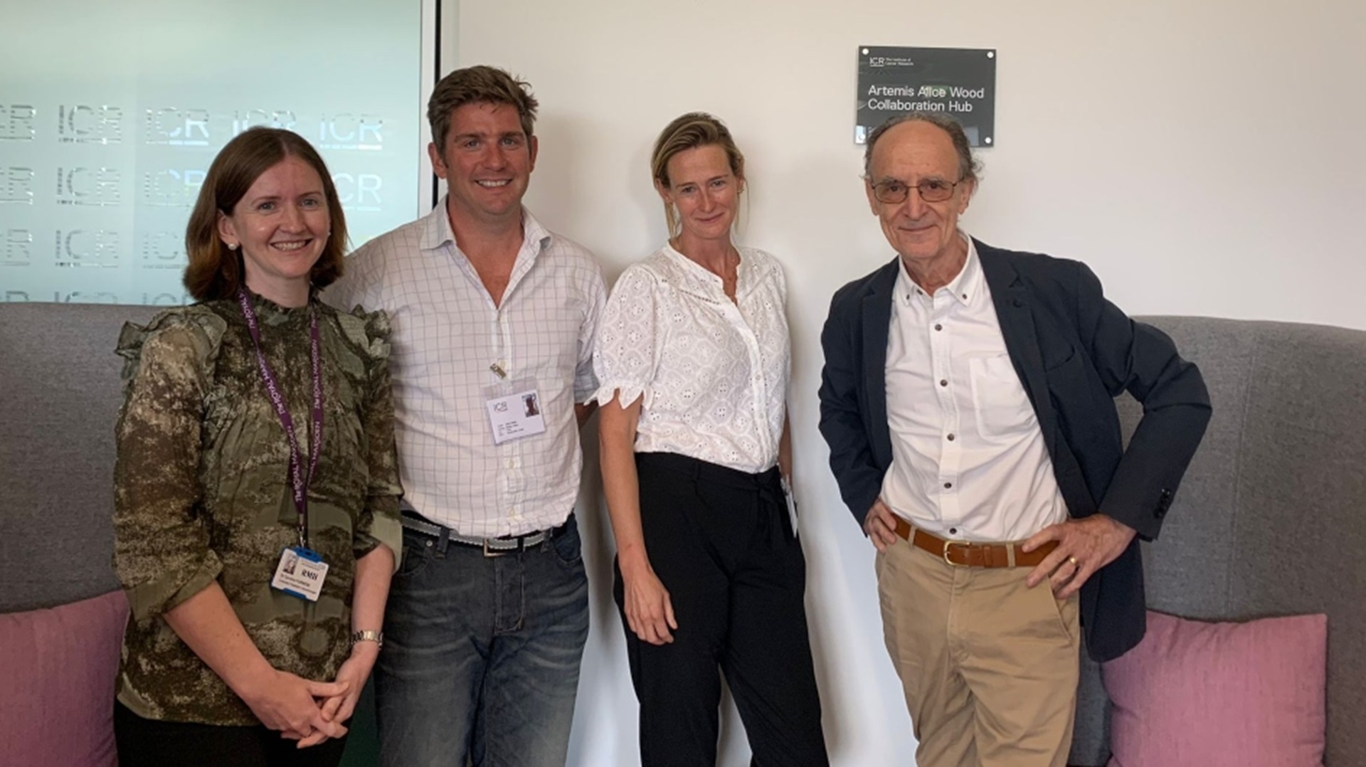 Dr Caroline Furness, Jody Wood, Juliana Wood and Professor Sir Mel Greaves standing in front of a plaque engraved with Artemis's name